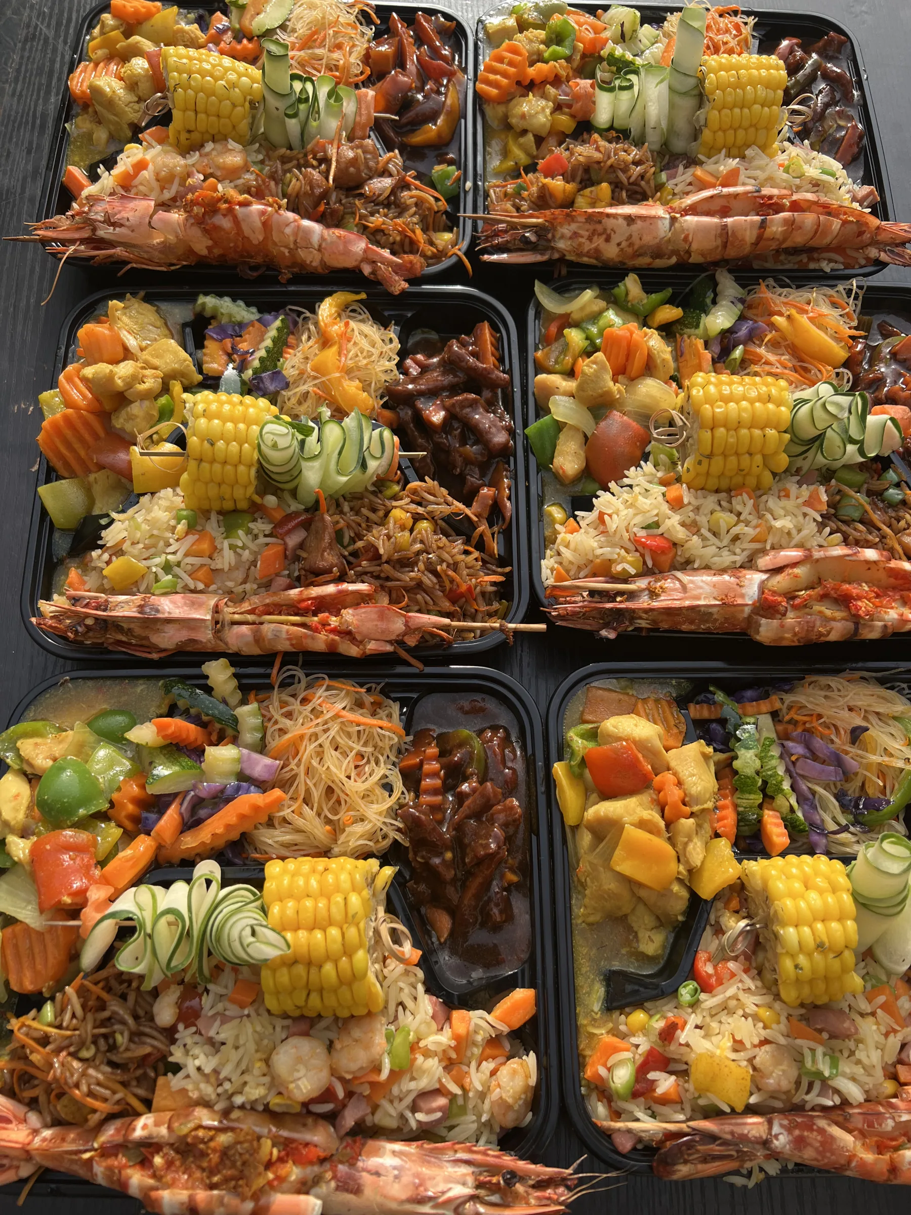 Cabbilicious Foods individual meal trays with prawns, rice, noodles and vegetables